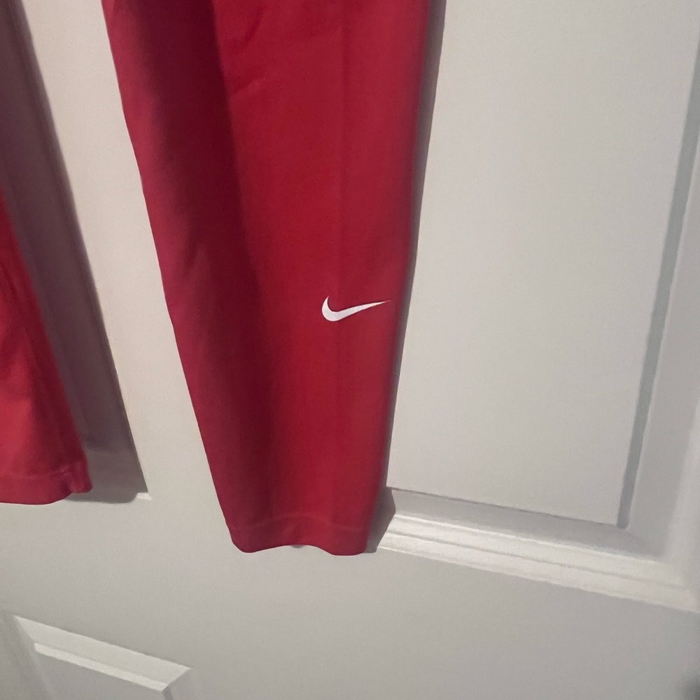Nike Women’s high rise  Red Leggings with White Swoosh Accent